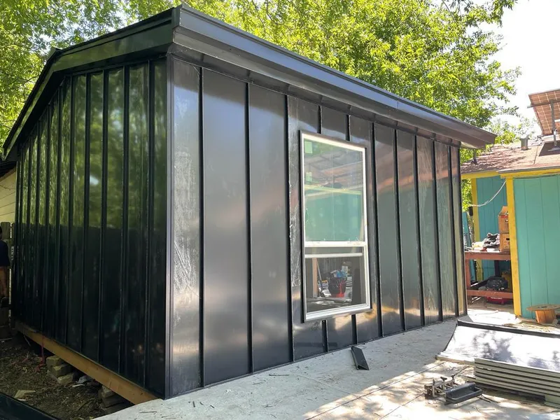 Black standing seam metal wall panels for Roof Inspection in Edwardsville