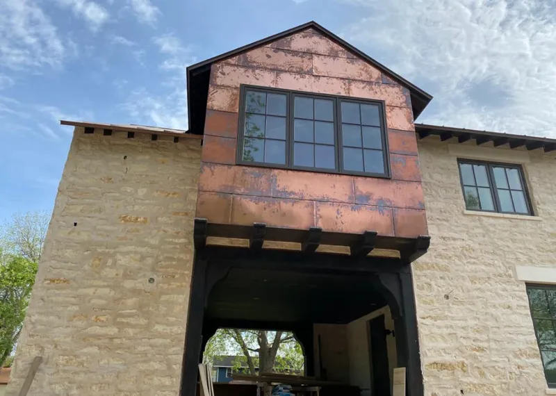 Copper metal panel facade on a stone building for Skylight Installation in Edwardsville